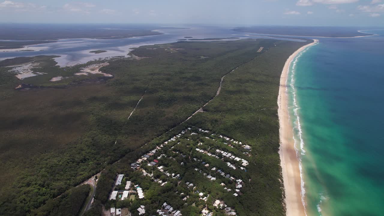 Panoramic View Over Rainbow Beach With Houses And Accommodations In Queensland, Australia - Drone Shot
