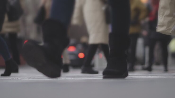 People Crossing a Busy City Street