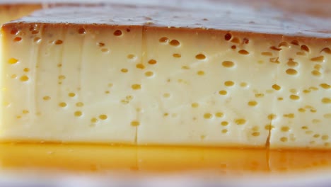 Caramel-custard-pudding-on-a-plate-on-table-,