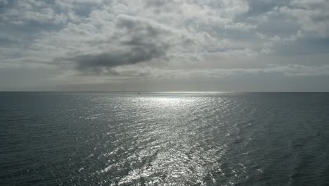 aerial views over beaches with calm and relaxing waves along the shore
