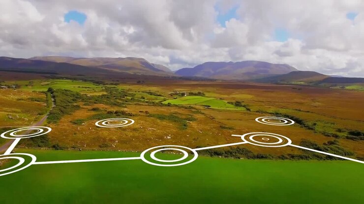 Animation of network of connections with icons over landscape and sky