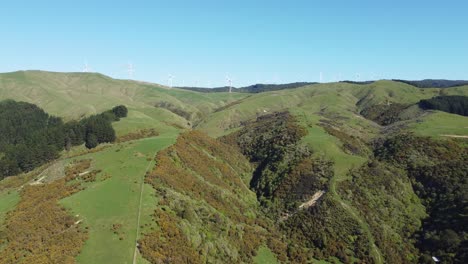 Slowly-flying-towards-a-wind-farm-along-the-ridge-of-a-hill