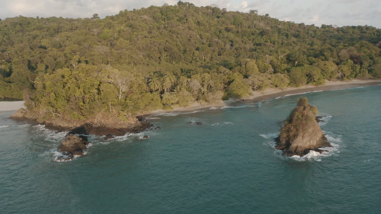 Drone Aerial view of a beautiful beach and the jungle in Manuel Antonio, Quepos, Costa Rica