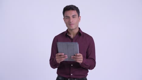 young handsome hispanic businessman