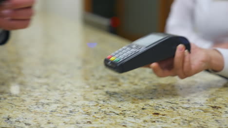 traveler at hotel reception. customer paying for services in hotel
