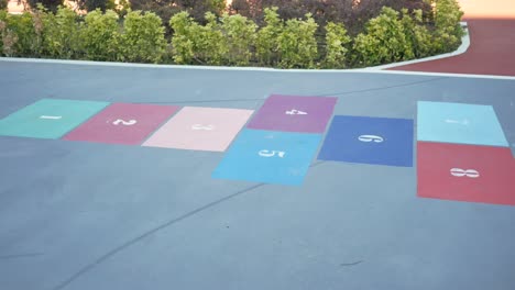 colorful hopscotch game on the sidewalk