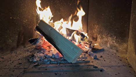 fireplace with firewood burning. slow motion, zoom-in shot