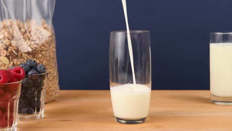 pouring a glass of milk for breakfast