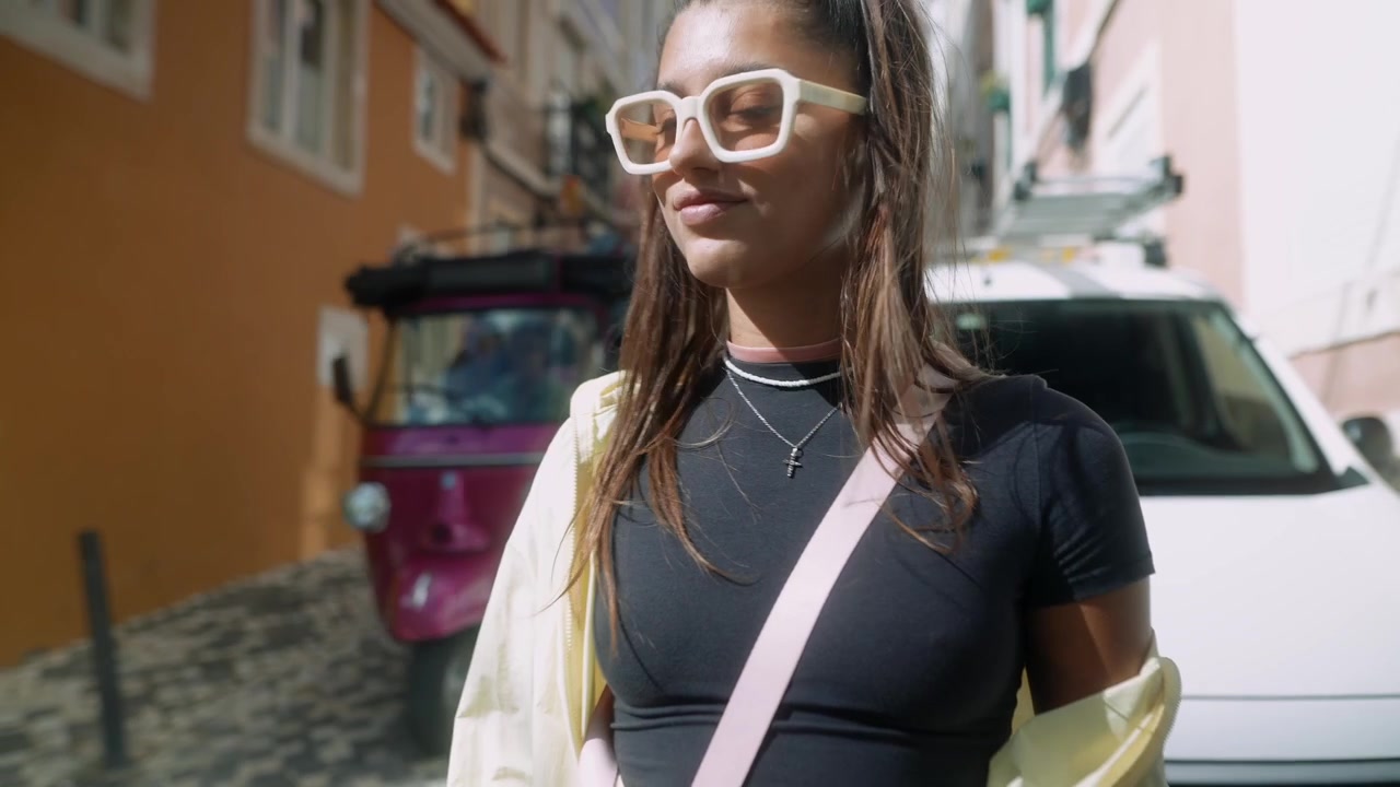 Young Woman Standing on Sunny European Street