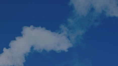 view of smoke coming out of chimney against blue sky. ecology and greenhouse effect concept. sweden.