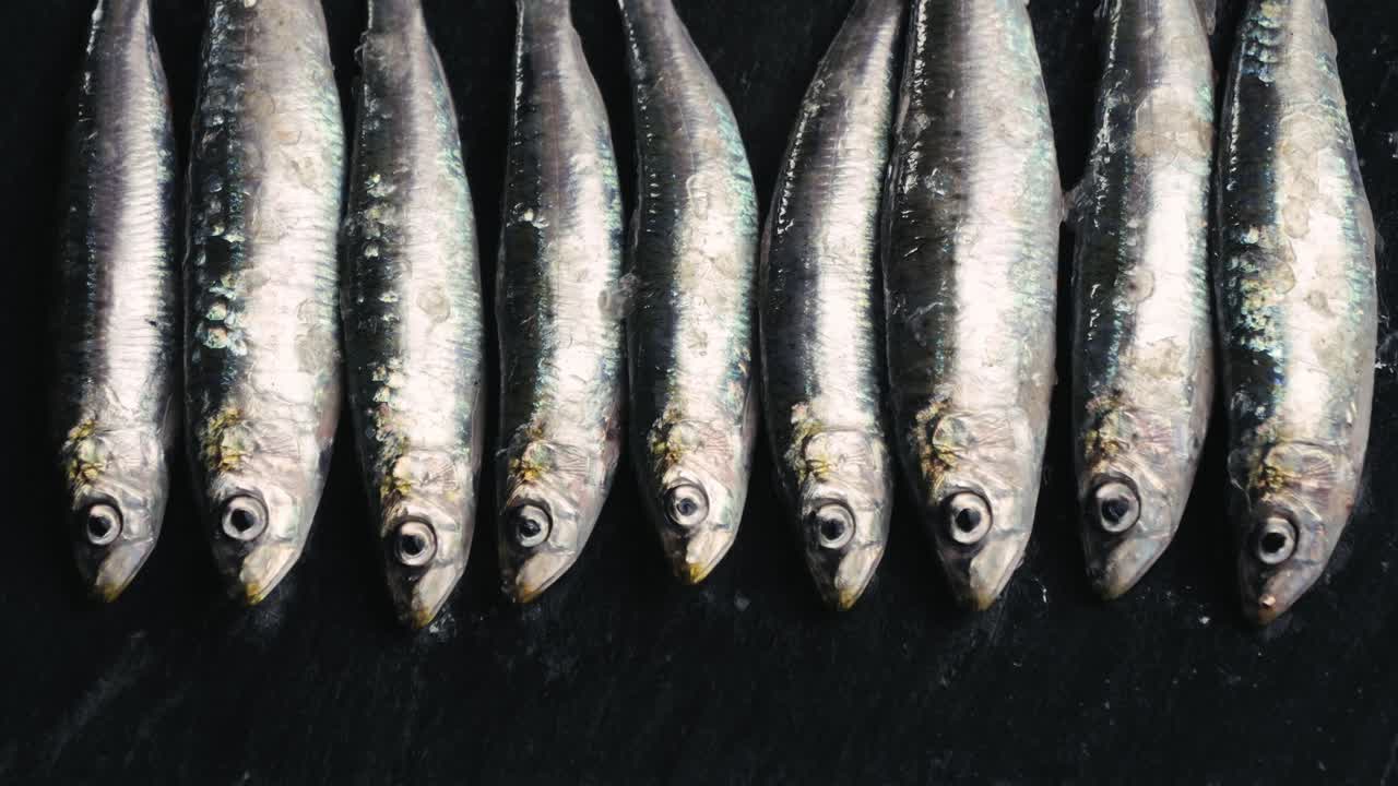 Fresh Sardines on a Dark Surface