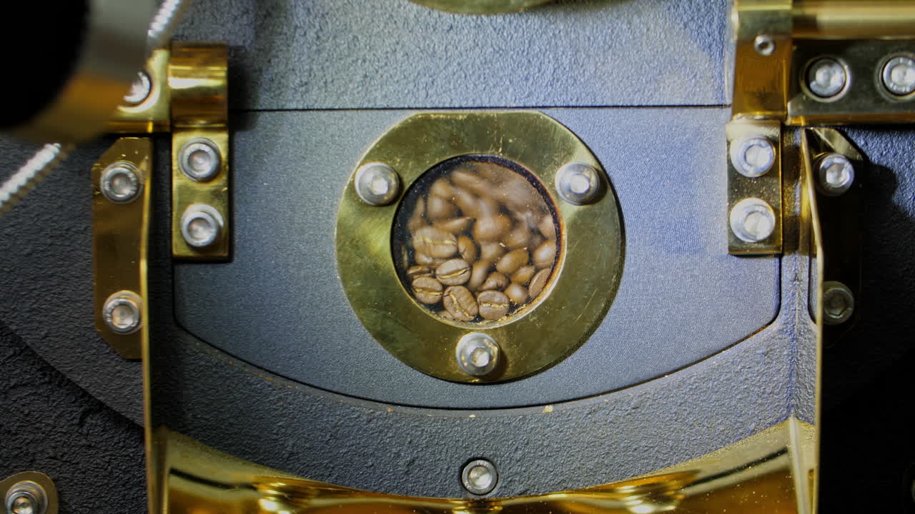 Roasted Coffee Beans In Modern Machine With Roaster