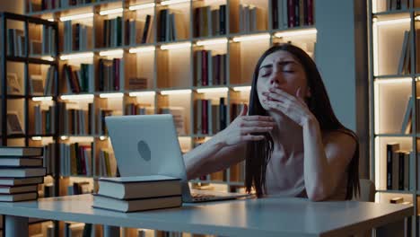 woman tired in library