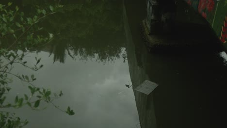 garbage and paper drifting above the river flow