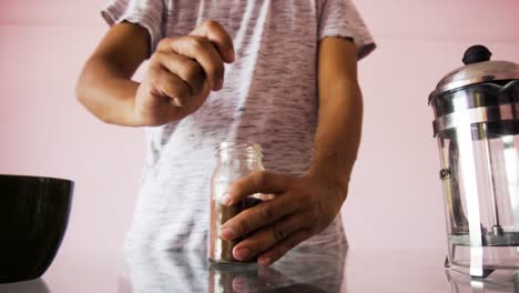 Young-Man-making-coffee-with-coffee-powder