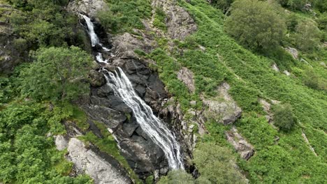 Drone-aerial-video-footage-of-the-Taylor-Gill-Force-Waterfall-at-Borrowdale,-Seathwaite-and-is-one-of-the-highest-waterfalls,-in-the-National-Park-Lake-District-United-Kingdom