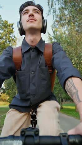 man riding a bike in a park