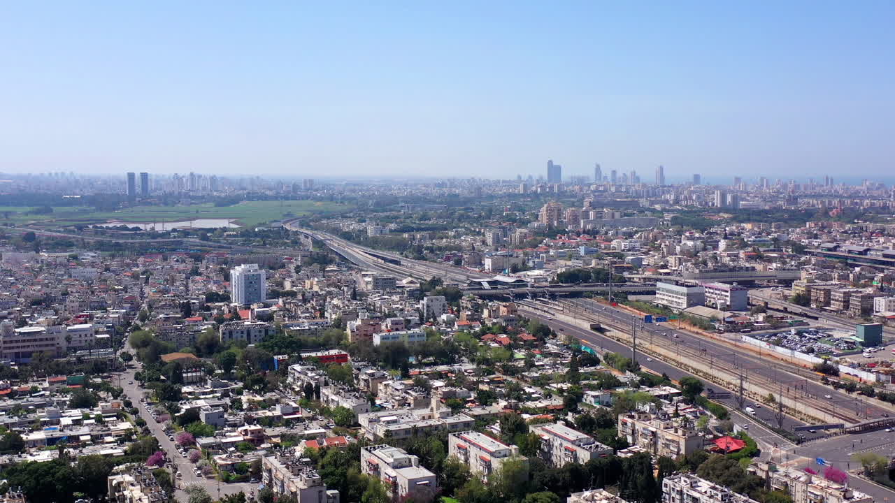 Aerial view of a city with highways and buildings