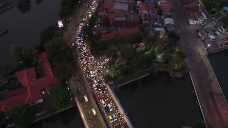 aerial perspective of the busy traffic in indonesia, east java, surabaya at night