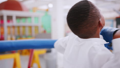 Boy-doing-a-centrifugal-force-experiment-at-a-science-centre