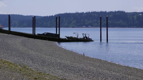 small, nondescript fishing loading onto trailer from public boat launch ramp at camano island state park, wa state 40sec-24fps slow motion