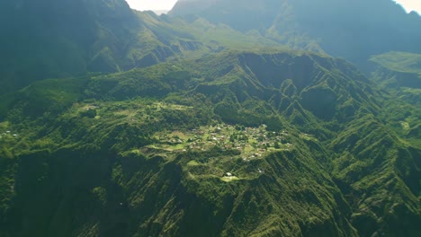 drone flying away from la nouvelle in the crater of the cirque du mafate on the island of la reunion