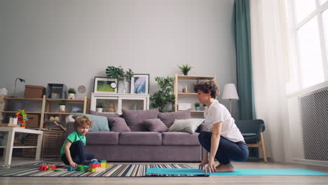 mother and child doing yoga together at home