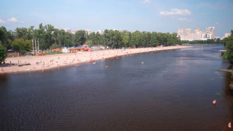 people at the beach near hydropark. swimming and enjoying summer.