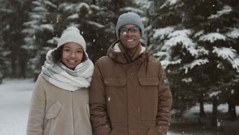 couple in winter forest