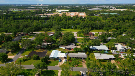 drone pullback descend above residential neighborhood with abundant greenery in tampa, florida