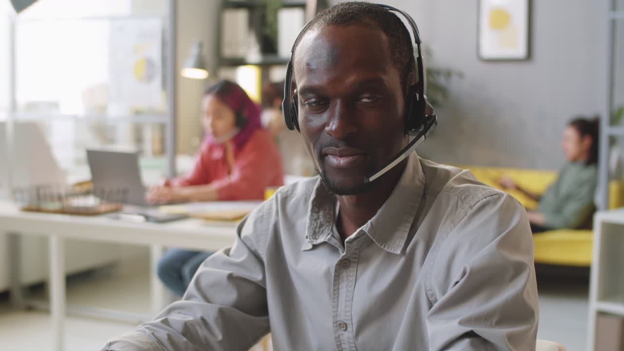 Portrait of African American Call Center Agent in Headset