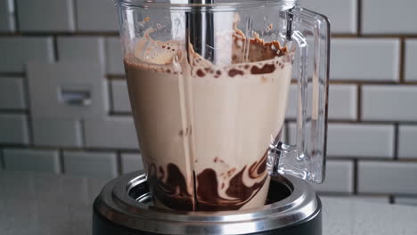 making a chocolate smoothie in a blender