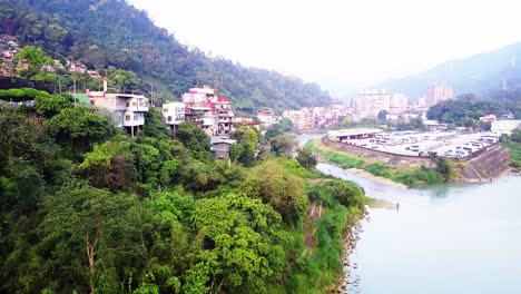 aerial pull out from cliffside shops