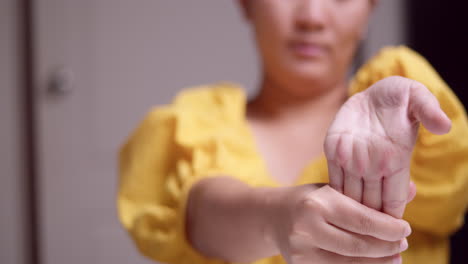 detail of female hands performing self-massage after an extensive day using technology