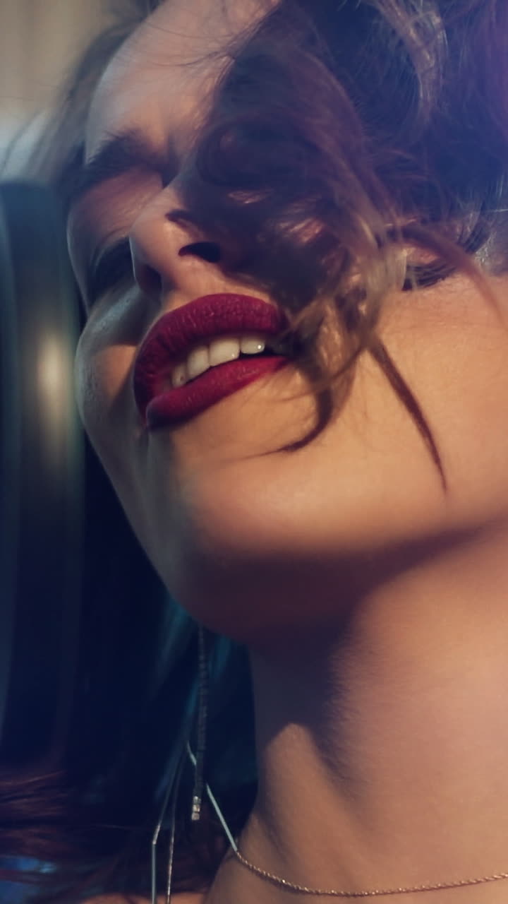 Woman singing in a recording studio. Female vocals. Professional recording studio. Slow motion Vertical video