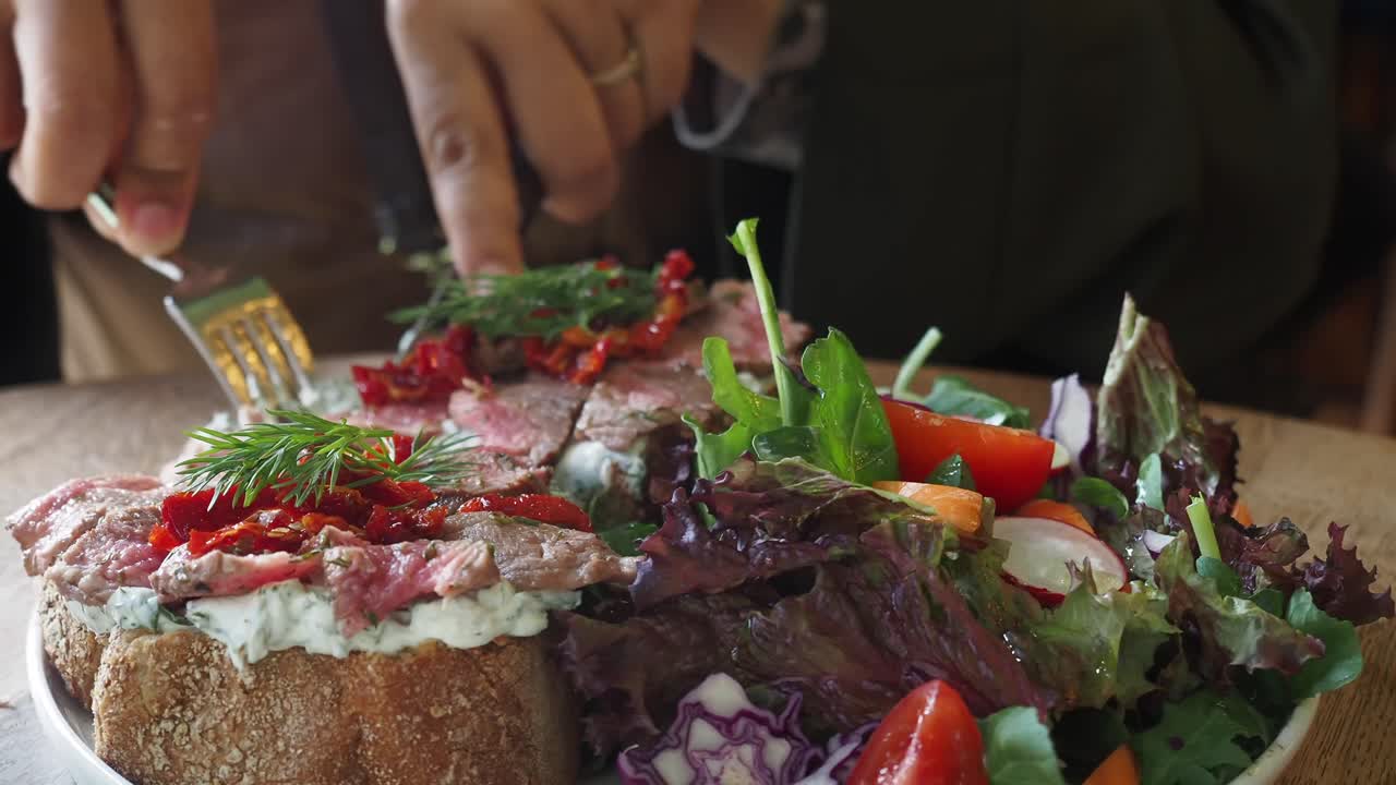 Delicious steak sandwich with salad
