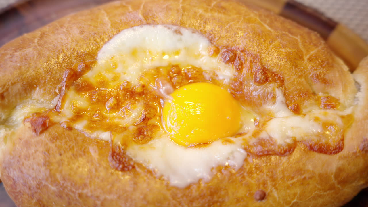 Georgian khachapuri cheese bread with eggs on top
