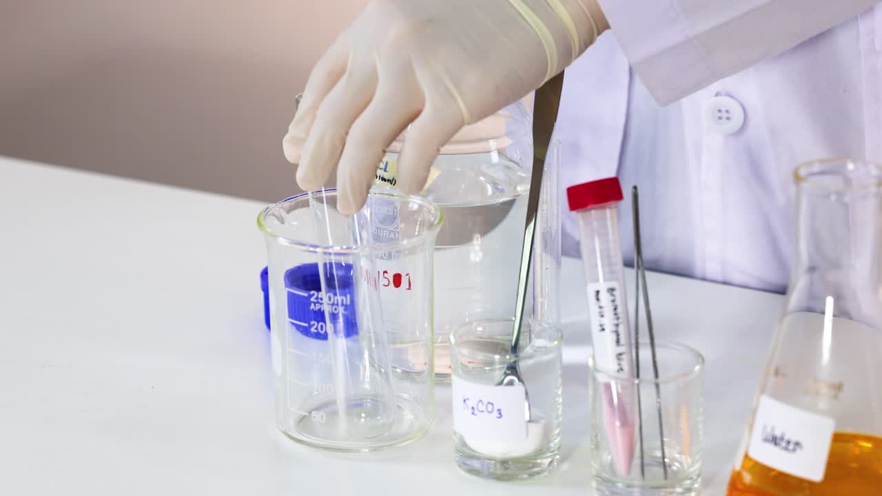 Scientist conducts bromothymol blue experiment in lab