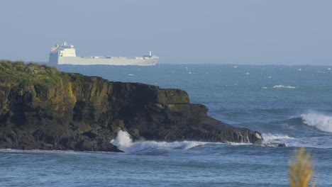 Big-cargo-ship-in-a-stormy-sea-on-big-waves