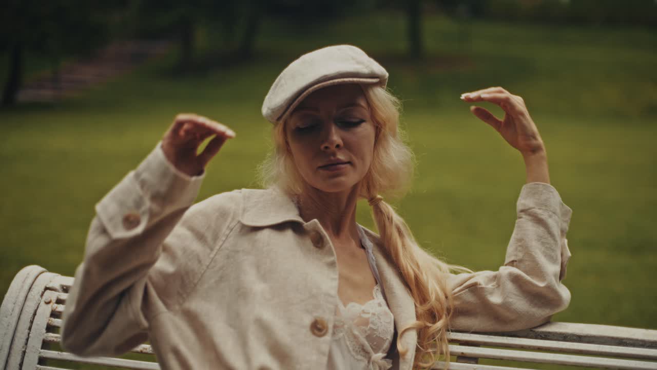 Elegant Woman Posing Outdoors on a Bench