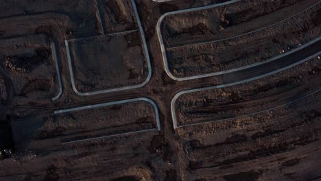 A-top-down-drone-shot-of-the-muddy-roads-at-a-construction-site