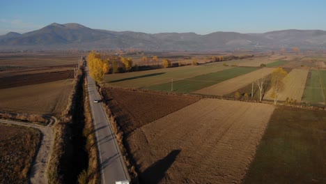 Lands-ready-to-be-planted-on-beautiful-field-with-Autumn-colors-and-mountains-background