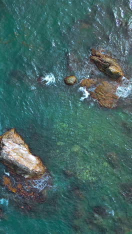 aerial view of rocks and waves