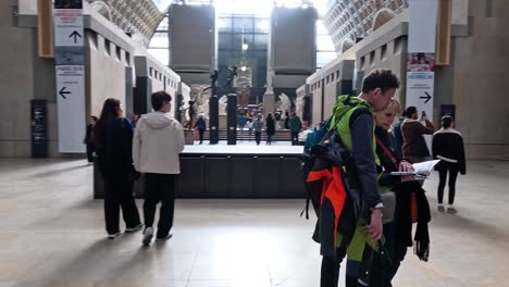 people exploring the museum's statue exhibit