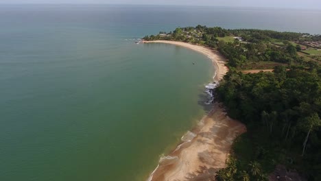 Aerial-view-of-Mermaids-Bay-with-waves-slowly-rolling-in-San-Pedro-Ivory-Coast-in-Southwest-Africa