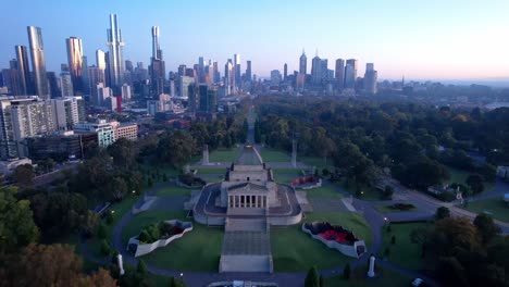 aerial forward shrine of remembrance, war memorial and melbourne sunrise skyline