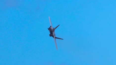f-22 raptor performs dynamic aerial maneuvers against a clear blue sky, showcasing agility and speed in a 12-second sequence