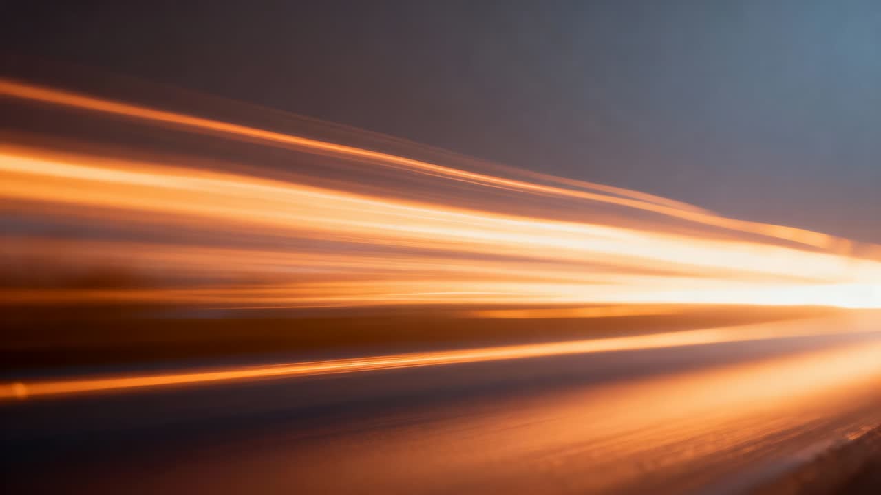 Streaming orange light streaks moving rightward toward bright point at right, triggered by shutter