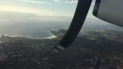 propeller commercial aircraft looking through window with view of propeller