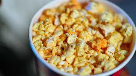 afro american guy eating popcorn.